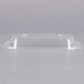 A Dart clear plastic container lid on a white surface.