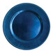 A round royal blue plastic charger plate with a beaded rim.