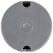 A gray circular object with a hole in it.