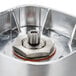 A Waring stainless steel blender jar with a metal blending assembly.