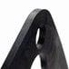 A close up of a black metal Waring plate gasket with holes.