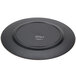 A black plastic charger plate with a beaded copper rim.