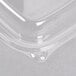 A clear Dart plastic container lid on a counter.
