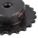 A black motor sprocket with an orange center.