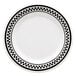 A white melamine plate with black and white checkered trim.