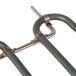 A metal pipe with a couple of metal rods.