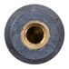 A close-up of a round metal threaded nut with a hole in the middle.