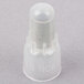 A white plastic cap with the letters "RC6" on it.