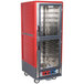 A red and silver Metro C5 heated holding and proofing cabinet with clear Dutch doors.