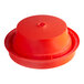 An orange plastic funnel support for a Bunn coffee brewer.