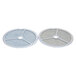 A pair of round metal discs with meshed metal filters in the center.