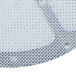 A close-up of a metal mesh screen with a white circle in the center.