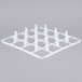 A white plastic grid with pegs for Vollrath glass racks.