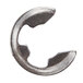A close-up of a metal Waring E-Ring.