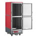 A red insulated full size hot holding cabinet with clear Dutch doors and universal wire slides.