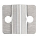 A metal piece with two holes in a stainless steel circle.