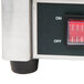 A close-up of a Waring crepe maker foot with a red switch