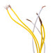 A yellow and white electrical cable with a white and yellow wire.