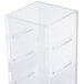 A clear plastic infusion chamber with holes.