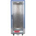 A blue Metro C5 hot holding cabinet with clear doors and shelves on wheels.