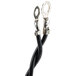 A close-up of a black cable with metal hooks.