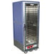 A blue Metro C5 hot holding cabinet with a clear door and silver metal interior.