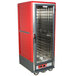 A red and silver Metro C5 hot holding cabinet with a clear door.