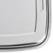 A close-up of a silver metal Waring drip pan.