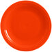 An orange Fiesta® Dinnerware chop plate with a rim.