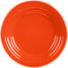 A close up of a Fiesta® Poppy luncheon plate with a circular pattern on the rim.