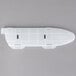 A white plastic Victorinox knife blade cover with black holes.