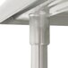 A close-up of the Advance Tabco stainless steel table leg with a metal pipe.