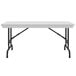 A gray rectangular Correll folding table with black legs.