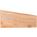 An American Metalcraft olive wood serving board with a curved edge.