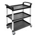 A black Cambro three shelf utility cart with wheels.