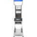 An Edlund stainless steel fruit and vegetable slicer with a blue handle.