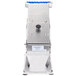 An Edlund stainless steel manual fruit and vegetable slicer with a blue handle.