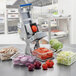 An Edlund ARC! vegetable cutter on a counter with onions.