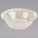 a white bowl with a ripple pattern