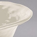 A GET Ivory melamine round catering bowl with a curved rim.