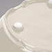 A white GET New Yorker round melamine bowl with a round object in the middle.