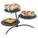 A Vollrath square adapter plate with three bowls of food on a stand.