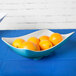 a group of oranges in a bowl