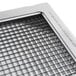 A close up of an Edlund 1/4" metal blade assembly with holes.