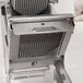 A person holding an Edlund 1/4" blade assembly for a Titan Max-Cut machine.