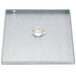 A metal plate with a hole in it.