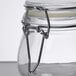 An American Metalcraft glass hinged apothecary jar with a metal clip lid.