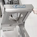 A person's hand holding a silver Edlund 8-wedge blade assembly.