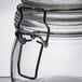 An American Metalcraft glass apothecary jar with a metal clip lid.