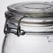 An American Metalcraft glass apothecary jar with a metal hinged lid and ring.